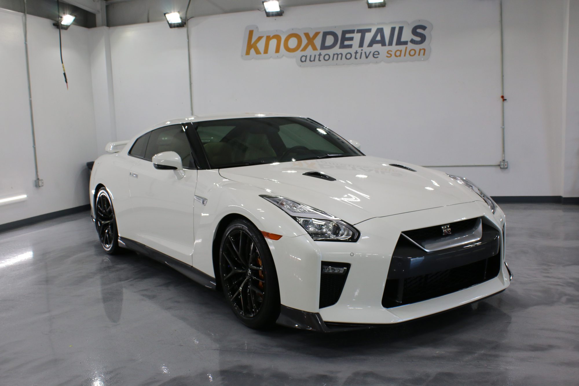 a white Nissan GT-R with paint protection film and ceramic window tint