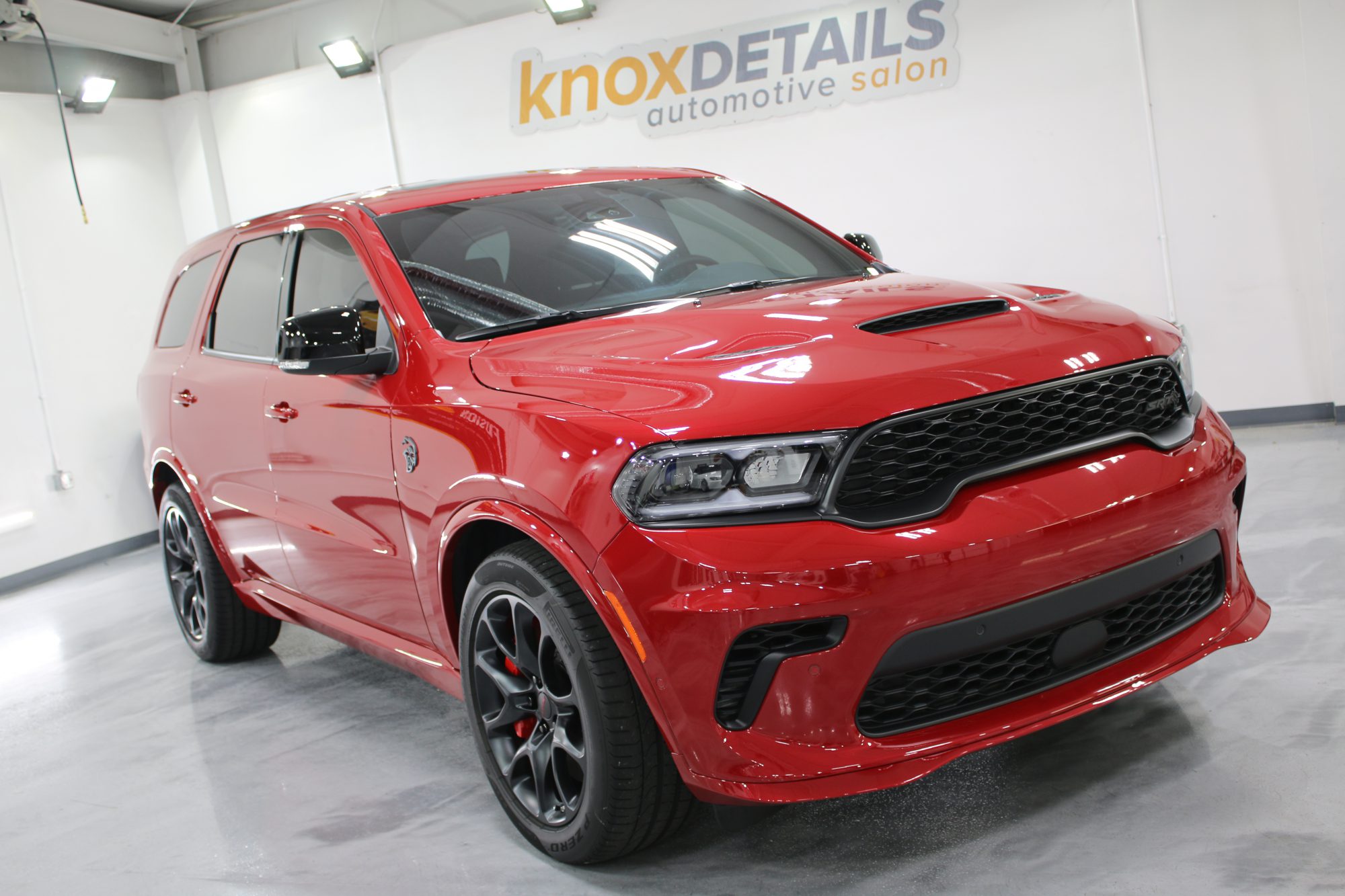 a red Durango SRT Hellcat with paint protection film and ceramic tint at Knox Details