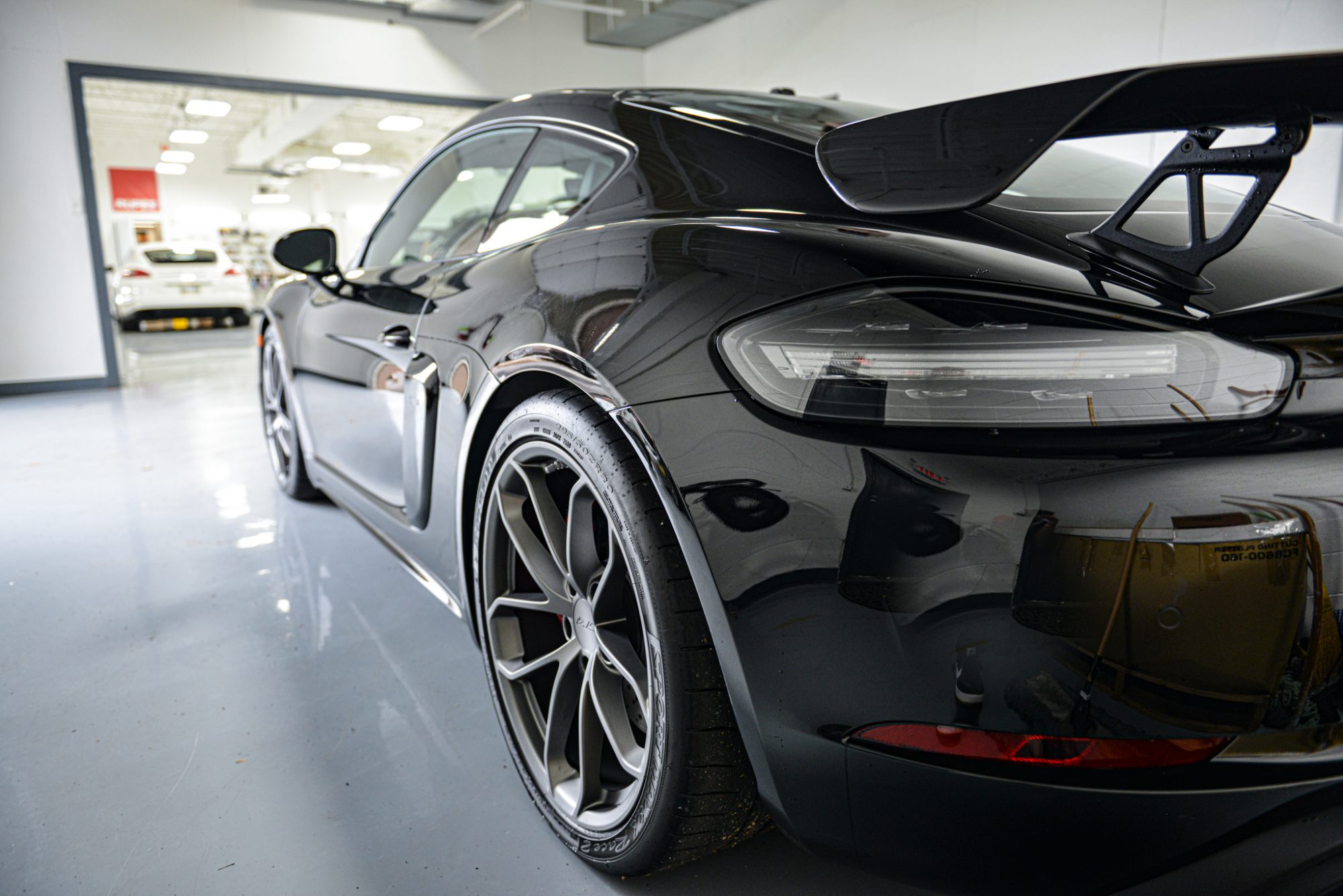 IMG_6350 a rear view of a black Porsche 911 GT3 with paint protection film