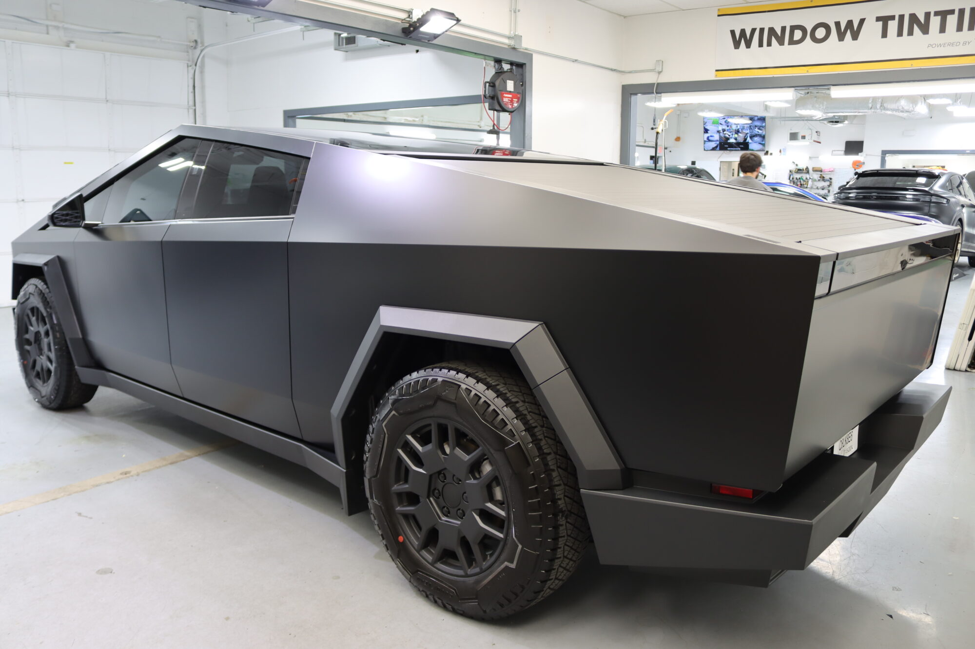 IMG_6350 rear view of a tesla cybertruck with full black matte paint protection film at Knox Detail
